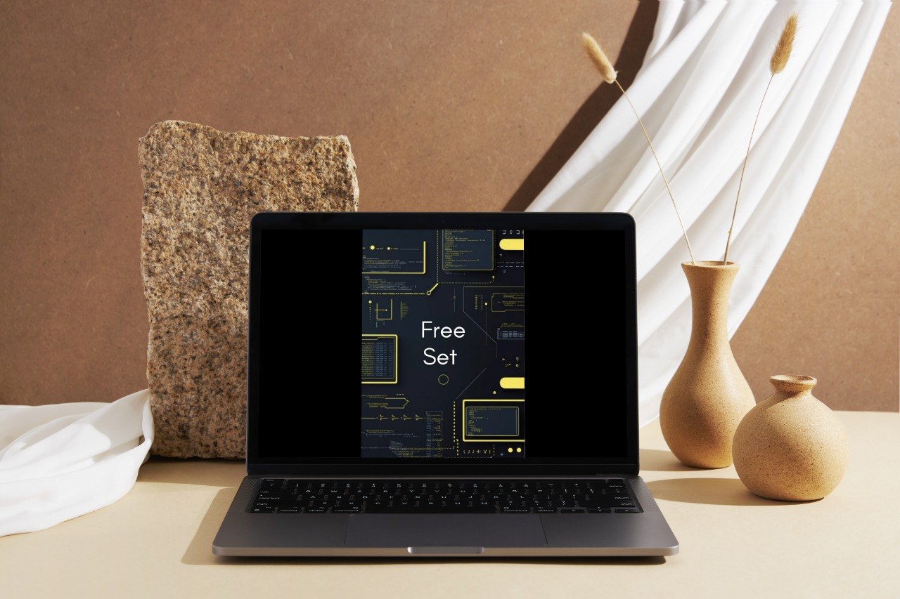 Laptop with a dark screen displaying text on a neutral background